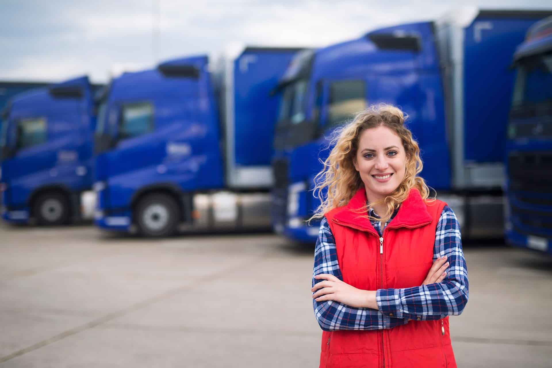 Truck Driver in Front of Trucks